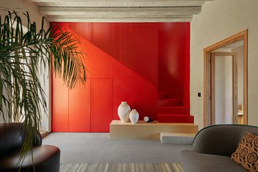 interior of home with a bright red accent wall