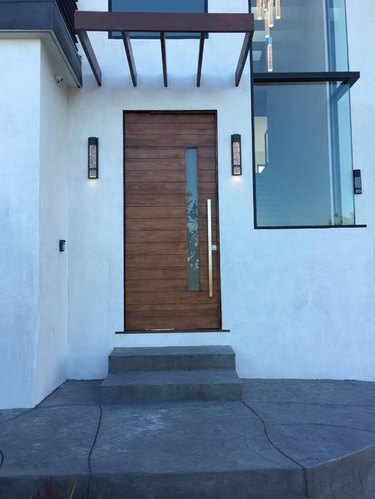 Modern wood door with a vertical glass panel