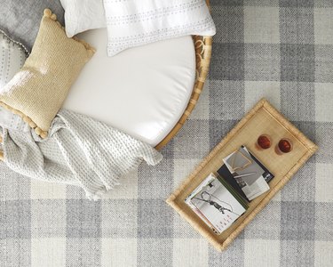 neutral furniture on gingham gray rug