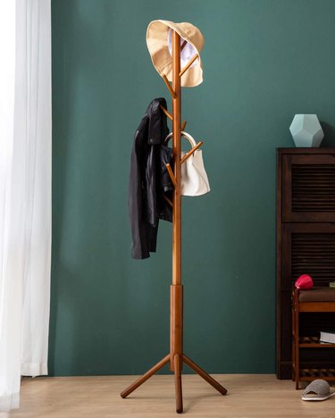 simple coat rack with hat and jacket