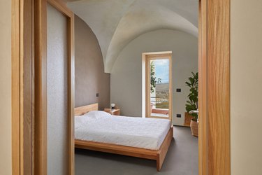bedroom with vaulted ceiling and bed