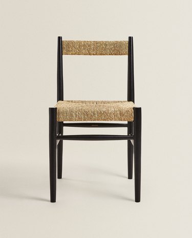 woven chair with black legs