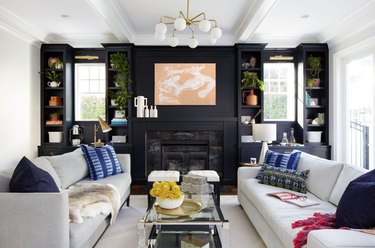 black living room with black fireplace surround