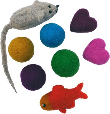 assorted colorful cat toys