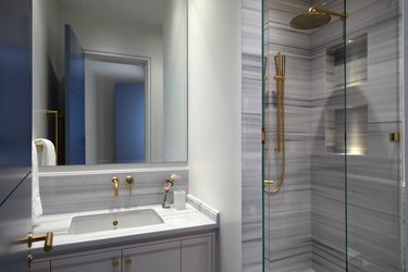 bathroom with sink and glass shower door