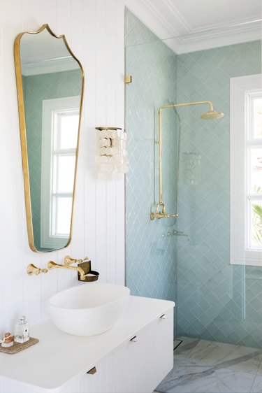 White bathroom with light blue tile