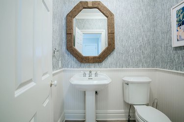 Small bathroom with roped mirror