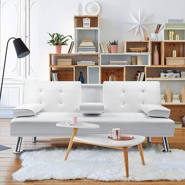 faux white leather futon in modern room