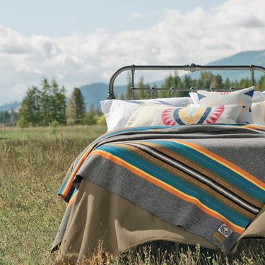 patterned bedding on bed in field
