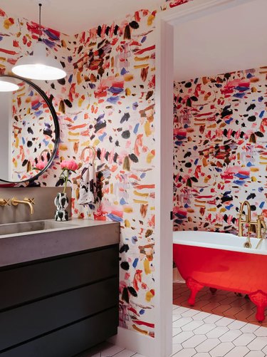 red tub colorful wallpaper maximalist bathroom