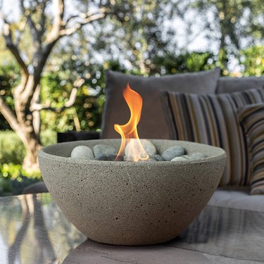light gray tabletop fire bowl outside