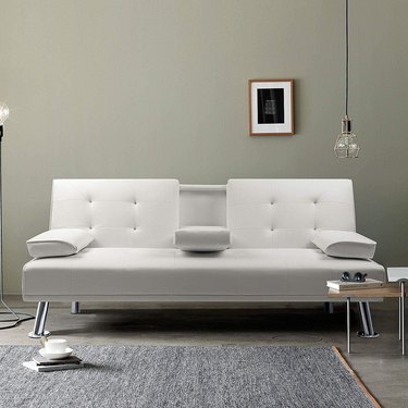 faux leather sofa in neutral living room