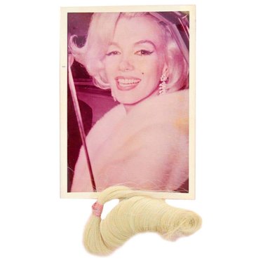 Photo of Marilyn Monroe with a lock of her hair