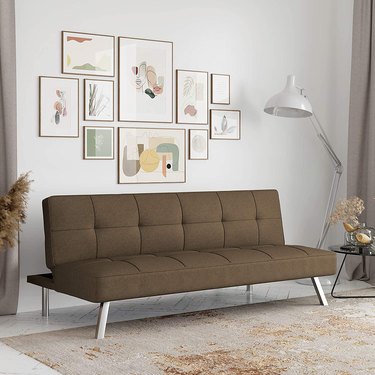futon in gray-green color in living room