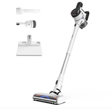 Tineco white Pure One S15 Essentials Smart Cordless Stick Vacuum Cleaner with two heads and a charging dock against a white backdrop
