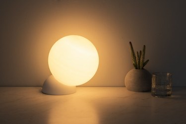 A glowing orb table lamp