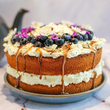 a cake with blueberry toppings