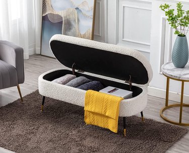 white boucle storage bench in sitting area