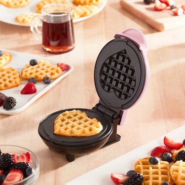 heart-shaped waffle maker on table