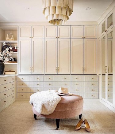 large closet with hanging chandelier