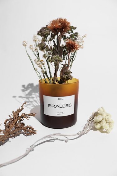 sidia braless candle and dried floral bouquet
