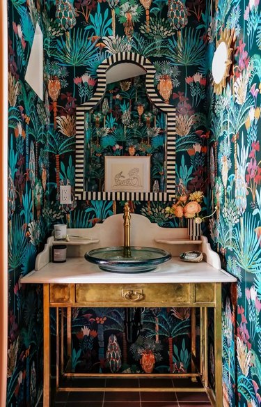 Art Deco bathroom sink vanity with decadent jungle wallpaper