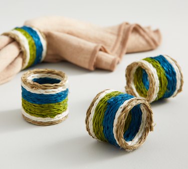 3 woven napkin rings in blue, green, and white