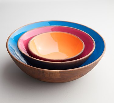 3 nesting bowls, one is blue, one is red, one is orange