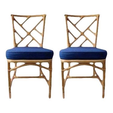 two bamboo chairs with blue seats