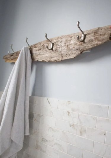 A driftwood rack with hanging towels