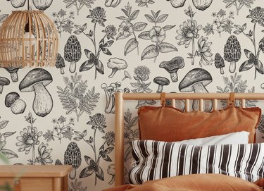 bedroom space with mushroom and botanical patterned wallpaper