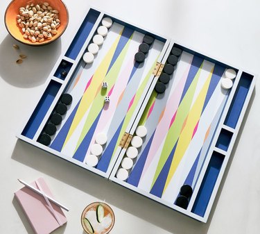 overhead view of table with backgammon and snacks