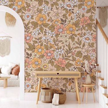 entryway with table and vintage-style floral wallpaper