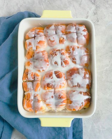 A rectangular dish full of cinnamon rolls