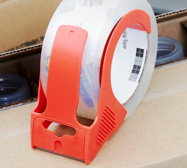 Close up image of shipping tape with a red tab.