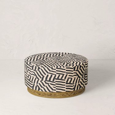 black and white patterned ottoman with wicker bottom