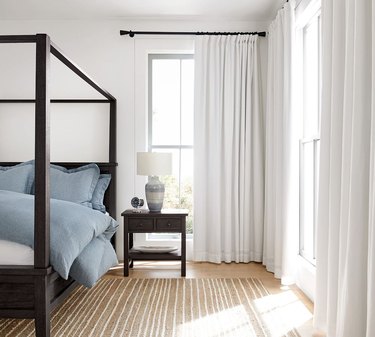 bedroom with white blackout curtains