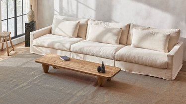 neutral couch with light wood coffee table