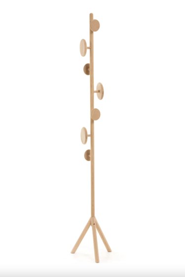 oak wood coat rack with eight circular pegs and small tripod base