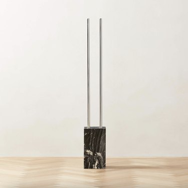 stainless steel simple coat rack with a black marble base