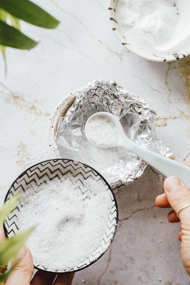 Combine salt and baking soda in aluminum foil to clean silver jewelry