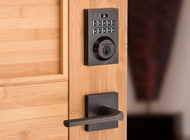 Kwikset SmartCode 913 Touchpad Electronic Deadbolt Installed on Wood Door