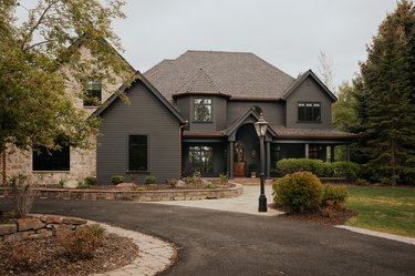 charcoal gray tudor with stone detailing