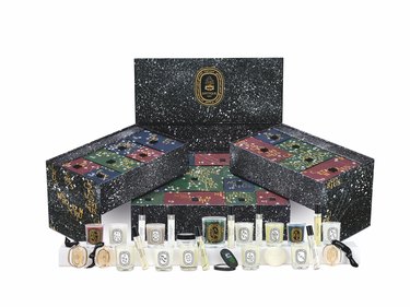 The fully open Diptyque Advent Calendar, which is black and features white constellations.