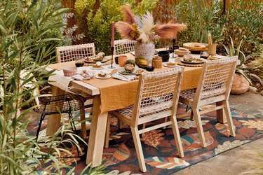 tonal tablescape anchored by an outdoor rug