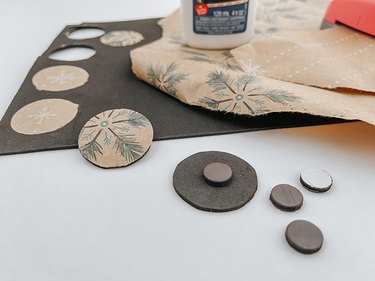 Instead of throwing away ripped gift wrap, turn it into seasonal DIY magnets!