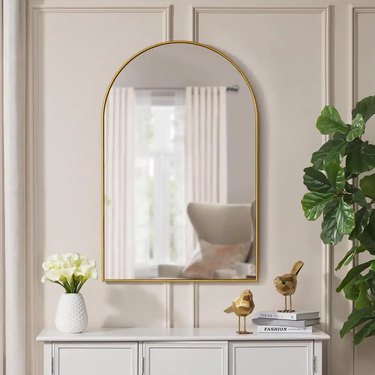 arched mirror with gold trim