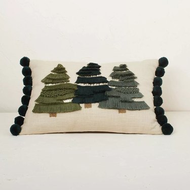 lumbar pillow with three fringed christmas trees