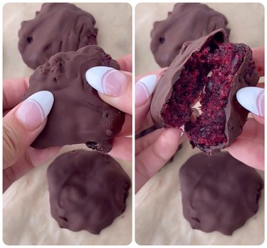 Two images: To the left is a jam bite, or a chocolate covered berry jam mixture. There is a close-up of a French manicured hand holding the jam bite. The second image is the jam bite torn in two, revealing a deep red berry mixture inside the chocolate coating.