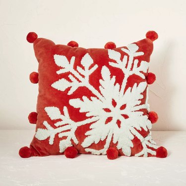 red and white snowflake pillow